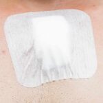 adhesive bandage on chest