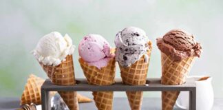 Four ice cream cones in a wooden stand